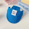 Close-up of blue cotton pet sun hat with adjustable strap and cute brand logo label - S / Blue