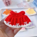 Close-up of handmade crochet doll dress with white fur trim and pearl bow details - Suitable For 15cm Doll / Red