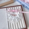 White heart-shaped pet bib with lace trim and a pink ribbon bow for cats and dogs - One Size / White