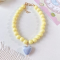 Close-up of yellow beaded pet necklace with iridescent heart pendant and gold clasp - XS (Neck 15-20cm) / Yellow Necklace