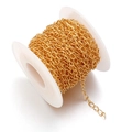 Golden DIY metal jewelry chain on a white spool for handmade accessory crafts - Gold