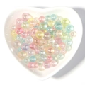Macro shot of colorful iridescent acrylic beads in a heart-shaped ceramic dish - 6mm No Hole (200 Pieces/Pack) / Plated (Multicolor)