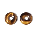 Detailed view of two polished tiger eye stone donut pendants with natural golden textures - Tiger Eye Stone Bracelet