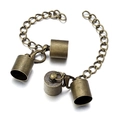 Macro detail of antique bronze lobster clasp set with cylinder end caps and chain - Bronze