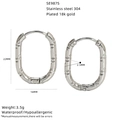 Detail view of textured stainless steel oval hoop earrings with size specifications. - Oval Hammered Style (SE987S) / Silver