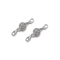 Macro shot of silver magnetic jewelry clasp with zircon inlay and dual lobster hooks - 10mm / Silver