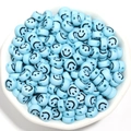 Light blue 7mm acrylic smiley face beads in a white bowl for DIY bracelet crafting - 100 Pieces/Pack / Blue