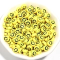 Bulk 7mm yellow acrylic smiley face beads in a white bowl for DIY bracelet jewelry making - 100 Pieces/Pack / Yellow