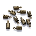 Macro detail of antique bronze cord end caps with loop for DIY jewelry making - Hole 2mm / Bronze