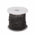 Macro shot of 1.5mm gunmetal finish beaded flat chain on spool for DIY jewelry - Curb Chain / Gun Black