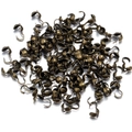 Macro shot of antique bronze calotte ends for professional jewelry cord finishing - 4mm / Bronze