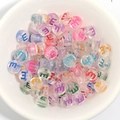 Transparent colorful acrylic alphabet beads with letter E in a ceramic bowl for DIY crafts - 100 Pcs/Pack / Letter E