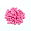 Detailopname van gepolijste roze esdoornhouten kralen met grote gaten voor DIY sieraden - Roze