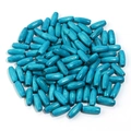 Macro shot of turquoise oval maple wood beads with natural texture for DIY jewelry making - Blue