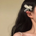 Close-up of sweet lace bow hair clip with cherry pendants on dark wavy hair. - Side Duckbill Clip / White Pink