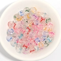 Transparent acrylic alphabet beads with colorful letters in a white ceramic bowl for DIY - 100 Pcs/Pack / L