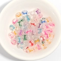 Colorful transparent acrylic letter beads for DIY bracelets shown in a white bowl - 100 Pcs/Pack / Letter T
