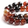 Macro shot of striped agate round beads showing detailed red and black banded texture - 6mm / Red-Black Striped (4#)