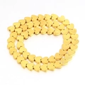 Macro shot of gold heart-shaped hematite beads on a string for DIY jewelry making - Heart Style (8mm) / Gold