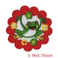 Close-up of a round cartoon frog embroidered patch with floral border measuring 3.76 inches - Wave Circle Hands Up Frog Style (PE4919CT)