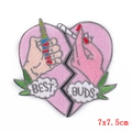 Close-up of Best Buds heart-shaped embroidered punk patch with vibrant stitching details - Broken Heart Cannabis Leaf (PE5138CT)