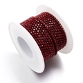 Deep red rhinestone cup chain on a white roll for DIY jewelry making and clothing - Dark Red