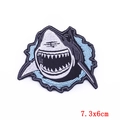 Macro view of 7.3x6cm fierce shark embroidery patch with detailed blue water waves - Fierce Shark Style (PE5819CT)