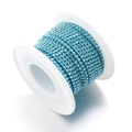 Light blue multi-row rhinestone claw chain wound on a white spool for DIY jewelry - Lake Blue