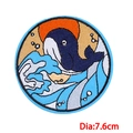 Close-up of circular wave whale embroidery patch with 7.6cm diameter and adhesive backing - Sunset Whale Style (PE8342CT)