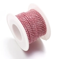 Pink rhinestone claw chain on a white plastic spool for DIY jewelry making and clothing - Light Pink