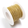 Champagne crystal rhinestone chain with gold claw base wound on a white spool - Light Yellow