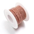 Rose gold rhinestone claw chain on a white spool for DIY jewelry and garment accessories - Peach Pink