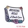 Colorful floral newspaper embroidery patch with Breaking News text for DIY clothing - Newspaper Breaking News (PE5965CT)