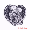Punk heart-shaped embroidered patch featuring kissing skeletons and star constellations - Kissing Skeleton Heart (PE6062CT)