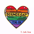 Rainbow heart embroidered patch featuring Sounds Gay I'm In text and yellow border - Rainbow Heart Style (PE6100CT)