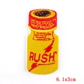 Close-up of RUSH bottle embroidery patch with detailed red and yellow stitching, 6.1x3cm - Yellow Bottle Logo Pattern (PE6139CT)