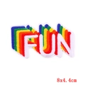 Détail de l'écusson arc-en-ciel FUN brodé avec des coutures denses et des couleurs vives - 8x4.4cm