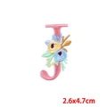 Detailed embroidery of letter J patch with pink border and colorful floral accents - Letter J (PE7615CT-J)