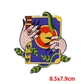 Detailed embroidery patch showing hands holding a heart book, size 8.5cm by 7.5cm - Mystical Holding Shape (PE8664CT)