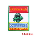 Close-up of embroidered green frog patch with colorful stripes for carnival apparel - Four-Color Stripe Frog Style (PE9449CT)