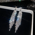 Close-up of sparkling rhinestone fringe earrings displayed on premium black velvet lining - Rhombus Tassel Style (13#)