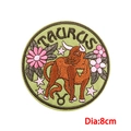 8cm Taurus zodiac embroidery patch with orange bull and pink flowers on green fabric - Taurus (PE9124CT)