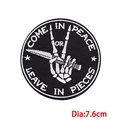 Detail of round punk skeleton embroidery patch with Come in peace or leave in pieces slogan - Skeleton Dagger (PE8670CT)