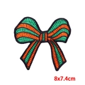 Detailed close-up of a striped 8x7.4cm orange and green bow embroidered iron-on patch - Bowknot Style (PE9608CT)
