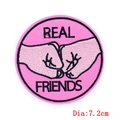 Detailed view of 7.2cm pink Real Friends embroidered patch with fist bump design - Fist Bump Real Friends (PE6342CT)