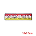 Embroidered red white yellow rectangular patch with LA CASA DE DETEL text 10x2.5cm - Three-Color Strip Text Rectangular Style (PE9571CT)