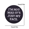 Detailed view of round 2.75 inch black patch with white embroidered sarcastic quote - Not Mad Face Style (PE12419CT)