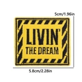 Macro detail of Livin the Dream square embroidered patch showing precise size measurements - Livin The Dream Caution Style