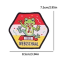 Close-up of Oeteldonk cartoon frog embroidery patch with Weegschaal scale text - Libra-Scale Frog (WEEGSCHAAL)