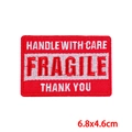 Handle with care fragile message embroidery patch in red and white colors, 6.8x4.6cm size - Pe8748ct